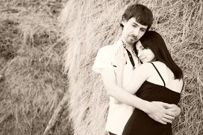 happy couple on the straw background