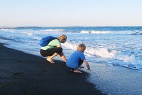 woman with her son on the beach