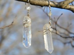 Hanging clear quartz on a tree branch