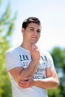 thoughtful brunet in the park
