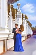 photo of bride and groom in a blue dress