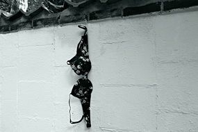 Bra hangs on wall