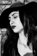 monochrome portrait of attractive woman in hat