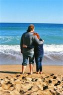 couple hugging on the beach