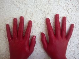 hands in red paint
