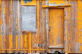 yellow weathered wooden wall