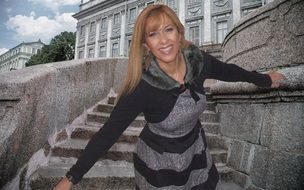 beautiful woman posing on a stone staircase