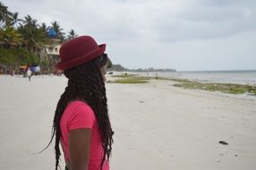 Young Girl in red Hat on Beach