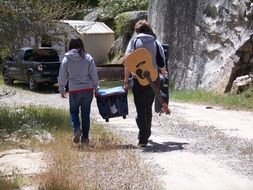 street musicians carry a chest