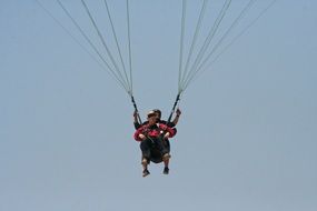 Paragliding, two persons on Parachute at Sky