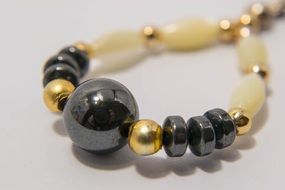 Pearls and stones in a blurred background