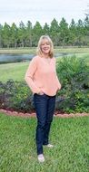 blond woman posing on the garden bed background