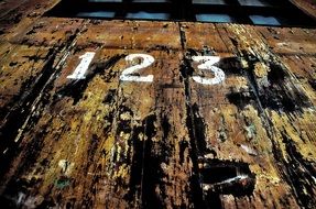 numbers on an old wooden door
