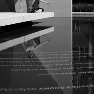 mirror image on the floor of a man in a yoga pose