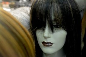 mannequin in black wig and dark lips