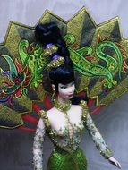 barbie doll in green outfit