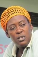 dark-skinned woman in a yellow hat