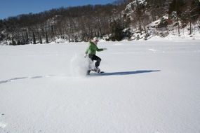 young woman running in the snow