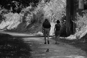 man and woman in the alley in the park