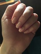 female hand with pastel manicure