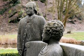 Stone figures of man and woman in the park