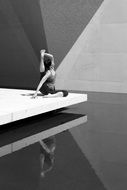 monochrome picture of woman practicing yoga