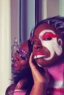 models posing with ornate faces