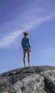 girl on Monadnock mountain in windy weather