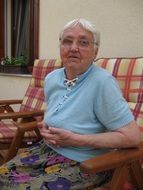 portrait of sitting grandmother on a chair