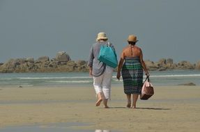Women walking on a beach