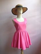 pink dress and hat on the mannequin