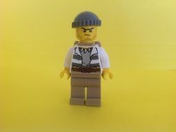 figurine in anger on a yellow background