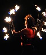 woman juggles with lights