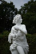 white woman statue in a park