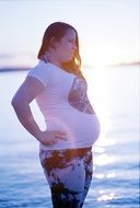 Girl Pregnant at Sunset