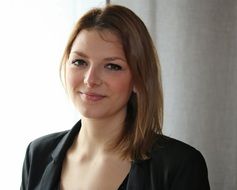 portrait of a young woman in black blazer
