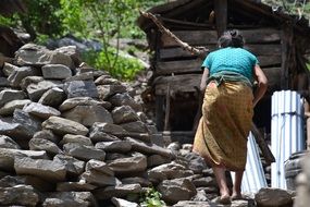 woman works on the stones in Nepal