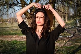 beautiful girl in a black shirt among nature