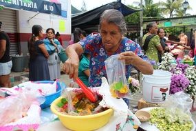 elderly woman in a market in mexico