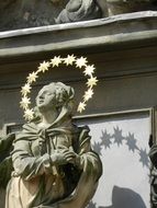 stone statue of a woman in prague