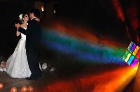 bride and groom are dancing