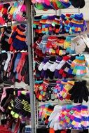 stand with gloves of different colors