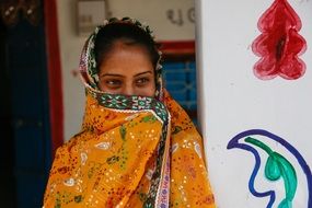 Beautiful young Indian Girl hold scarf at face