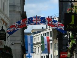 banners and flags on lines across Carnaby Street, uk, england, London