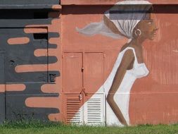 graffiti of a black woman in a white dress