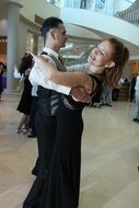 beautiful couple is dancing tango