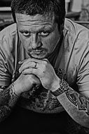 Seriously man with tattoos on a hands