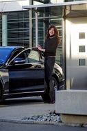 elegant businesswoman sitting in mercedes