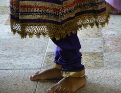 barefoot woman in traditional indonesian costume