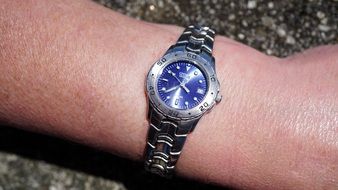 blue watch on a man's hand